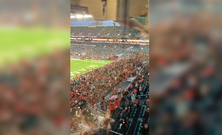 Watch Miami Hurricanes fans catch cat in American flag after insane fall from upper deck